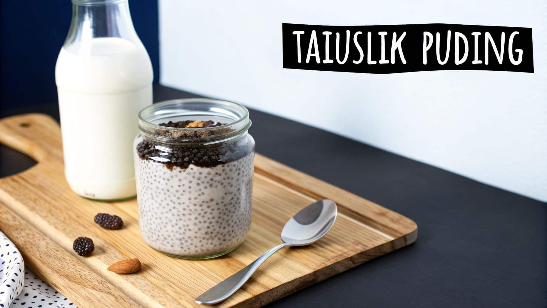 Пудинг из чиа в банке с бутылкой молока, ягодами и миндалем на деревянной разделочной доске.